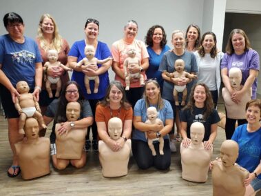 group of people in cpr training